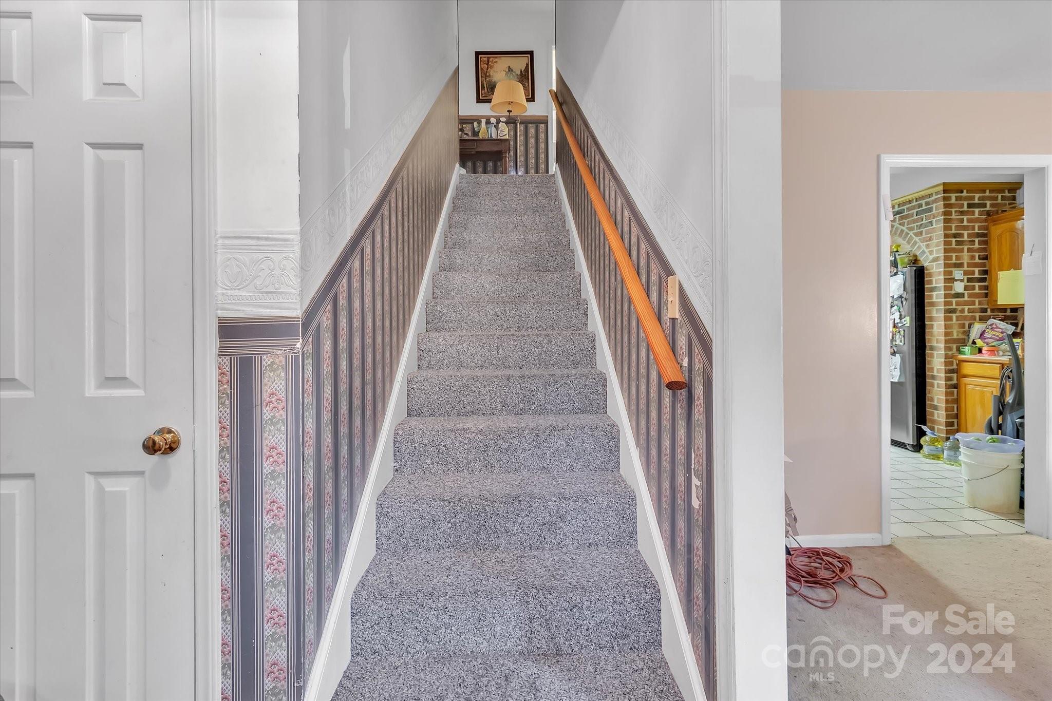 2131 Pinebrook Circle Charlotte, NC 28208 - Photo 11 of 23 a view of a hallway with wooden floor and entryway
