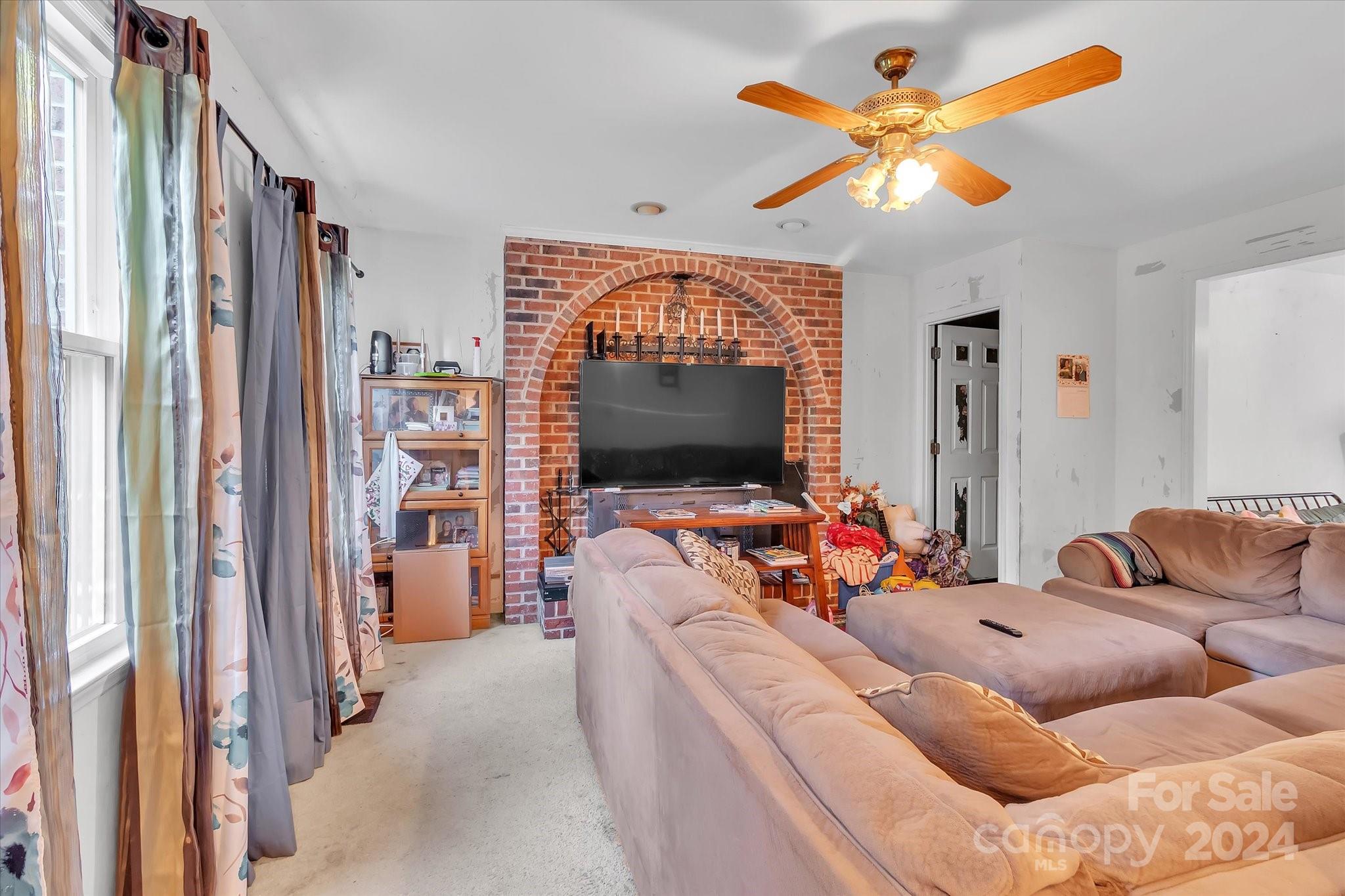 2131 Pinebrook Circle Charlotte, NC 28208 - Photo 20 of 23 a living room with furniture and a flat screen tv