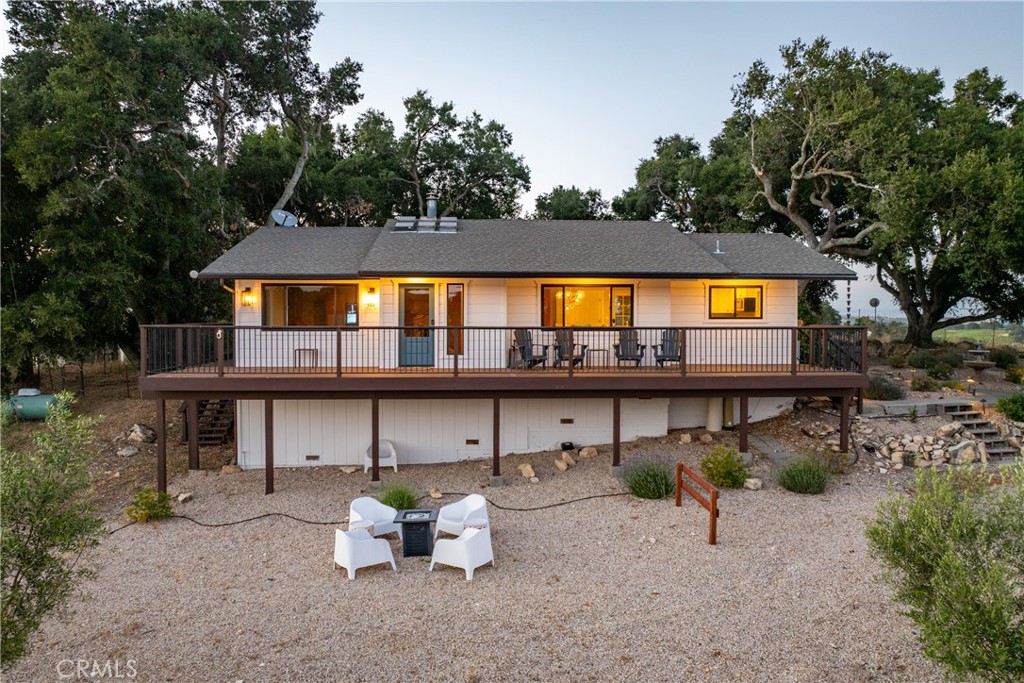 115 Booker Road Templeton, CA 93465 - Photo 18 of 76 a view of a swimming pool with potted plants and large trees
