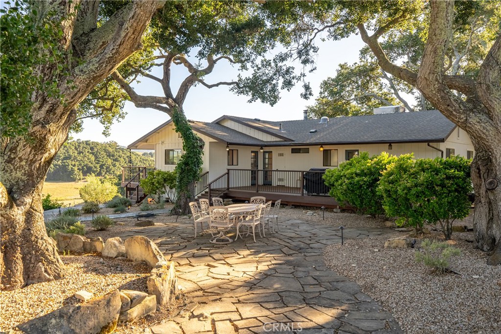 115 Booker Road Templeton, CA 93465 - Photo 19 of 76 a backyard of a house with table and chairs under an umbrella