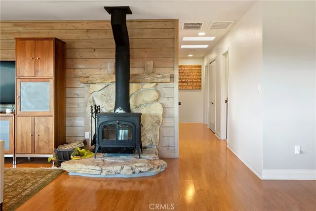 a view of a dry yard with wooden fence