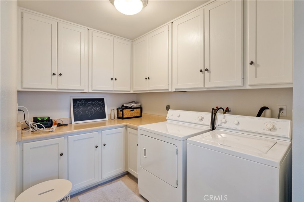 115 Booker Road Templeton, CA 93465 - Photo 48 of 76 a view of a storage and utility room with washer and dryer