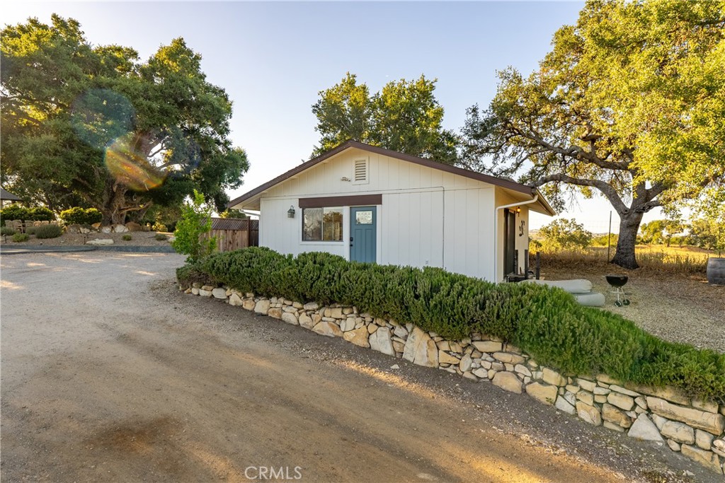 115 Booker Road Templeton, CA 93465 - Photo 54 of 76 a front view of a house with a yard and a garage