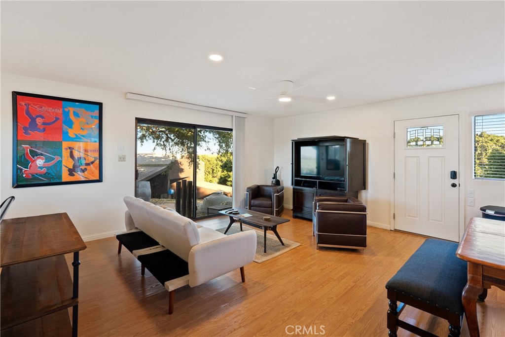 115 Booker Road Templeton, CA 93465 - Photo 57 of 76 a living room with furniture two large window and a flat screen tv