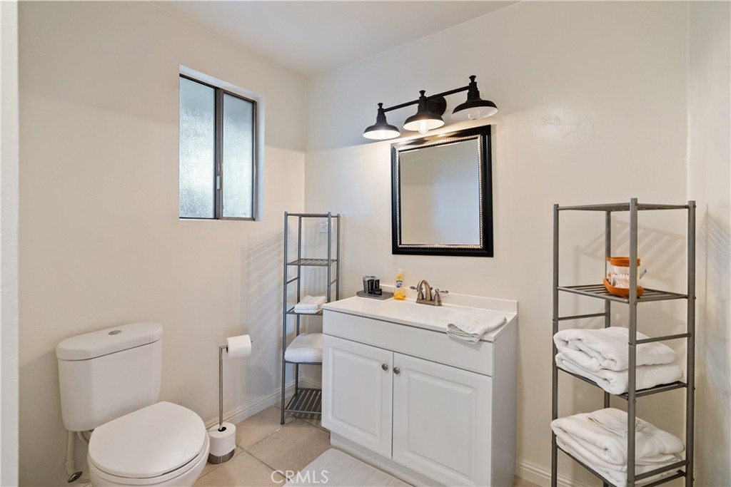 115 Booker Road Templeton, CA 93465 - Photo 60 of 76 a bathroom with a toilet sink and mirror