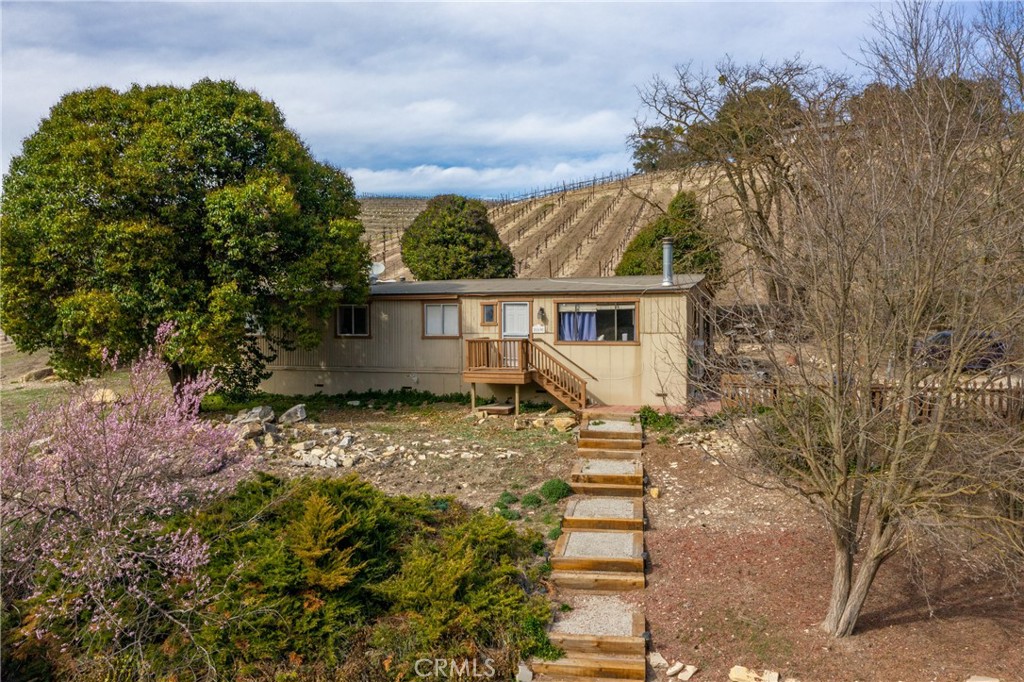 115 Booker Road Templeton, CA 93465 - Photo 71 of 76 a view of a house with a small yard and a tree