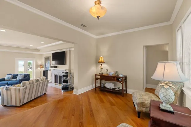 a bathroom with granite countertop a sink a mirror and a bathtub