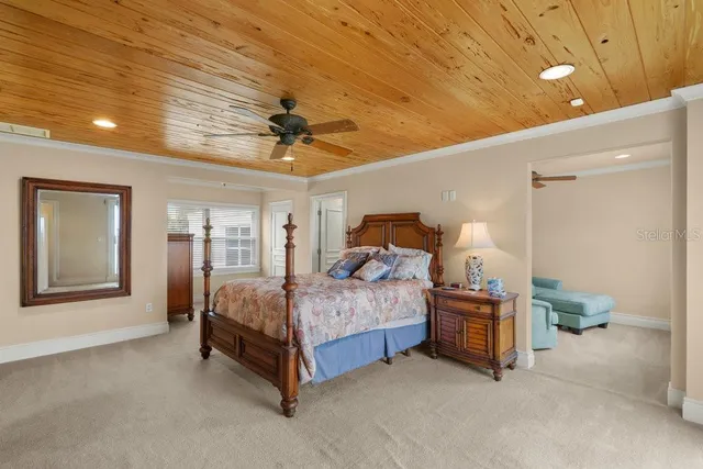 a spacious bathroom with a double vanity sink a mirror a and a window