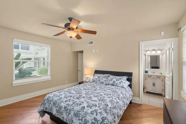 a front view of a house with plants