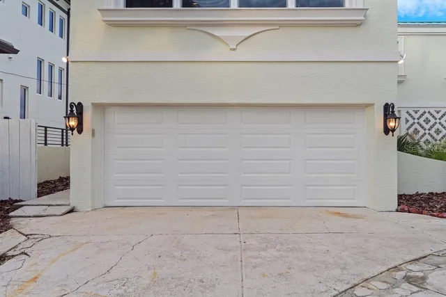 a dining room with furniture a chandelier and wooden floor