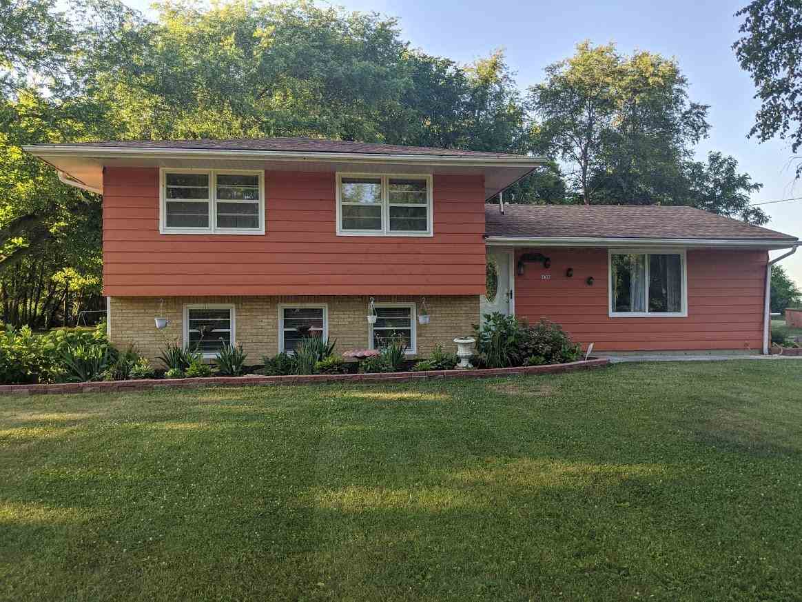 4769 Pelley Road Rockford, IL 61102 - Photo 33 of 33 a front view of a house with a garden