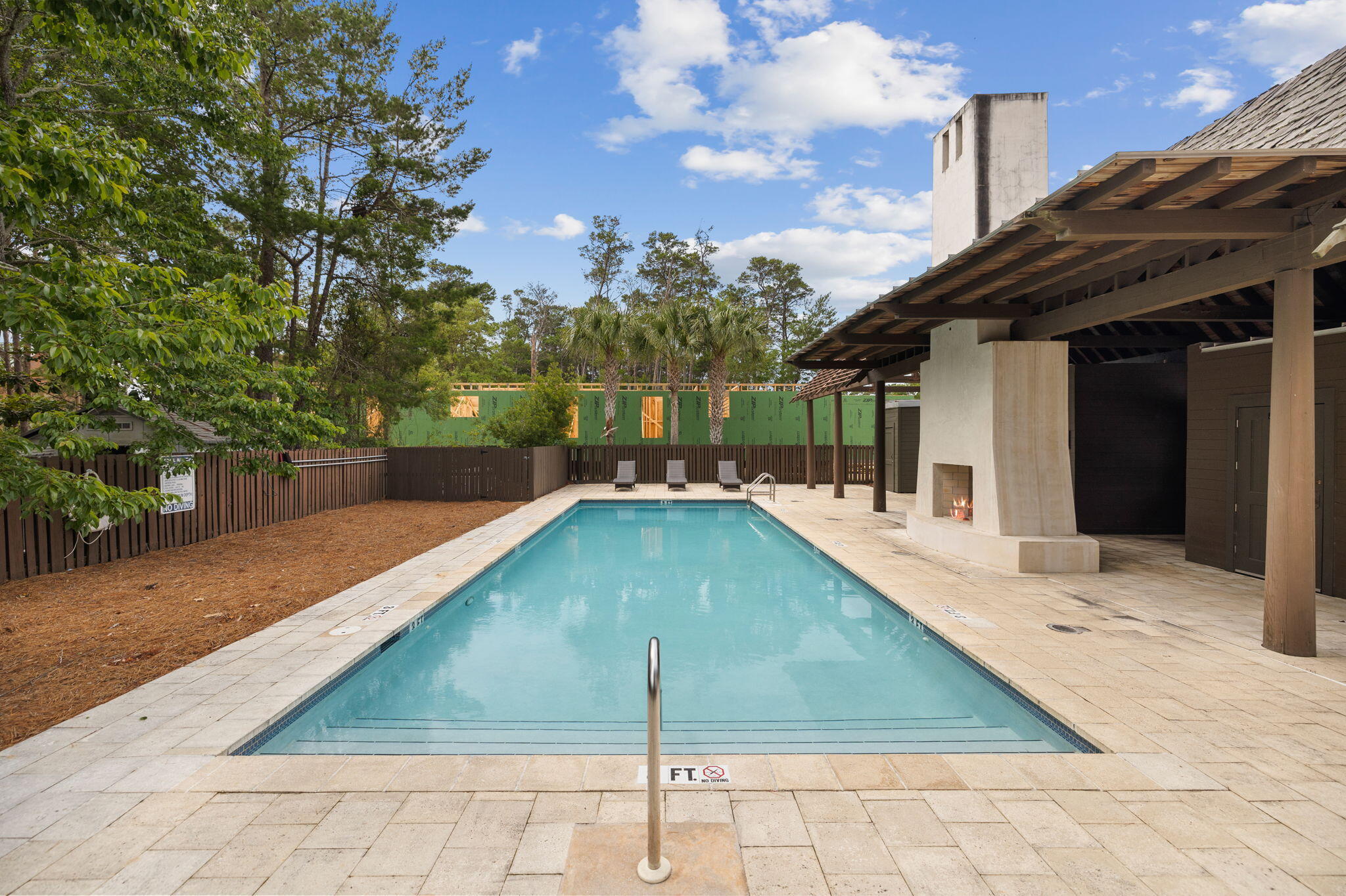 107 Pine Cone Inlet Beach Inlet Beach, FL 32461 - Photo 23 of 24 a swimming pool with some trees in the background