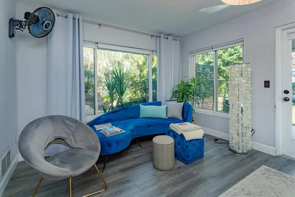 a living room with furniture and a window