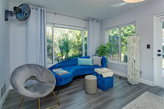 a living room with furniture and a window