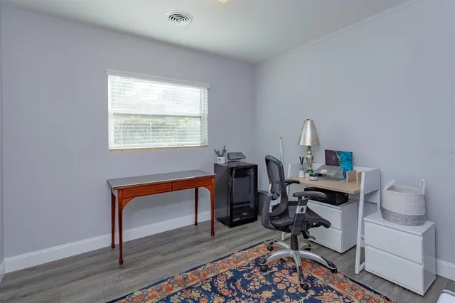 a view of a workspace with furniture and a workspace