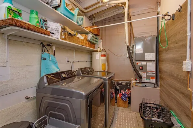 a utility room with dryer and washer