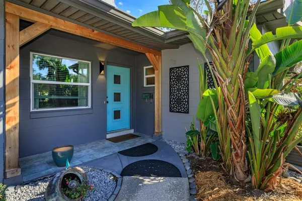 a backyard of a house with seating space