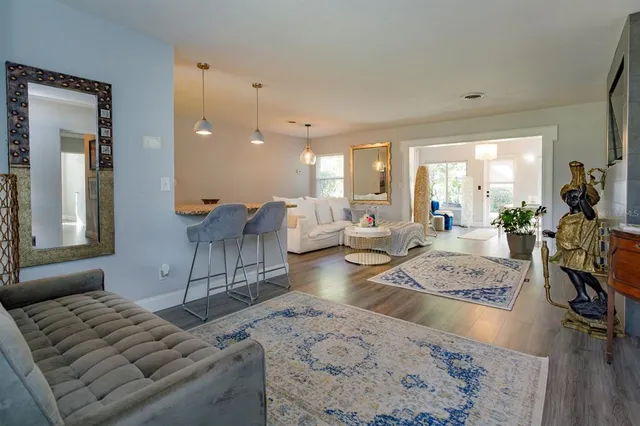 a living room with furniture and a table