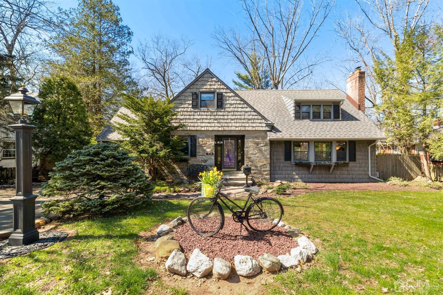 424 Chain O' Hills Road Colonia, NJ 07067 - Photo 1 of 36 a view of a house with swimming pool and sitting area