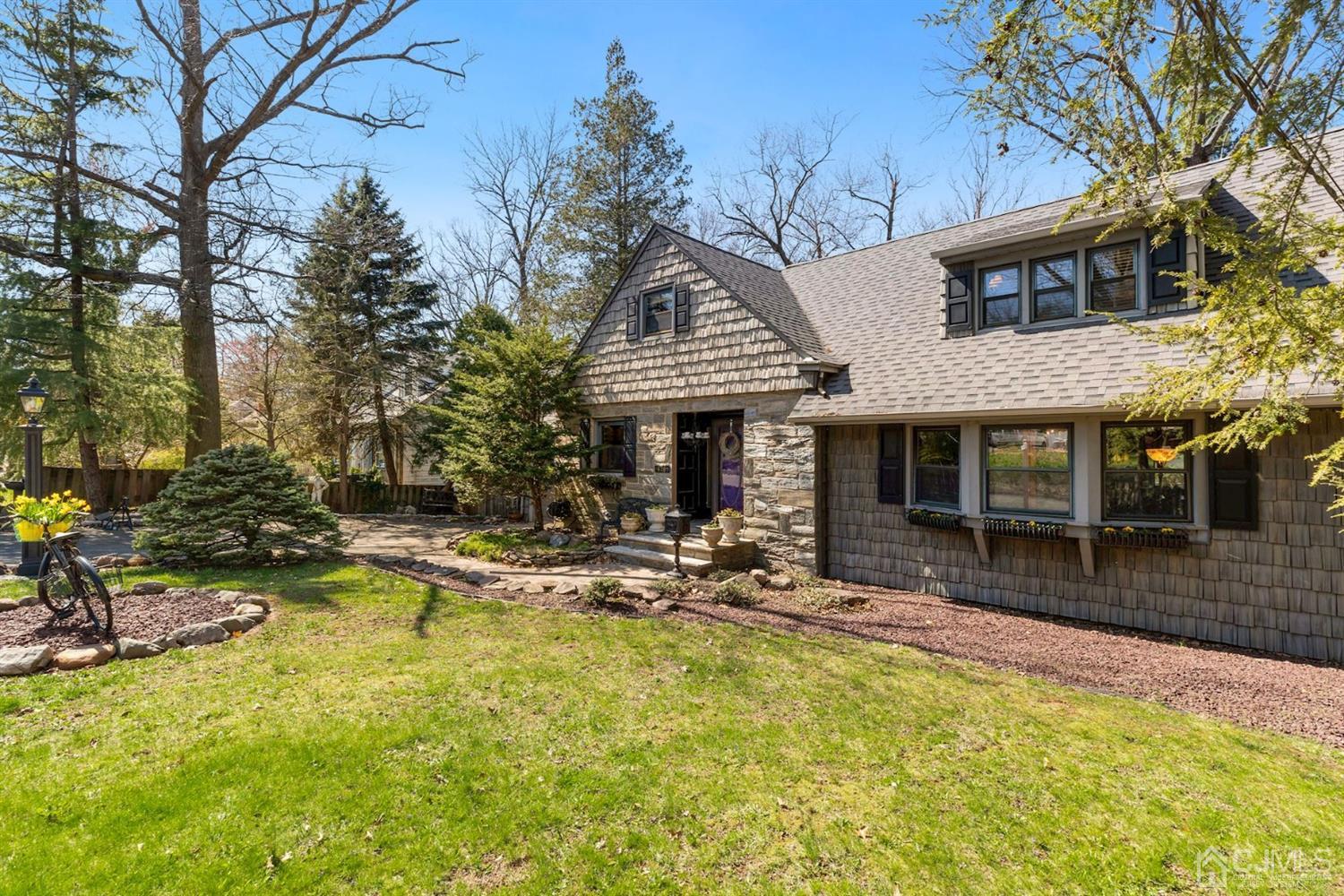 424 Chain O' Hills Road Colonia, NJ 07067 - Photo 2 of 36 a view of a house with swimming pool and sitting area
