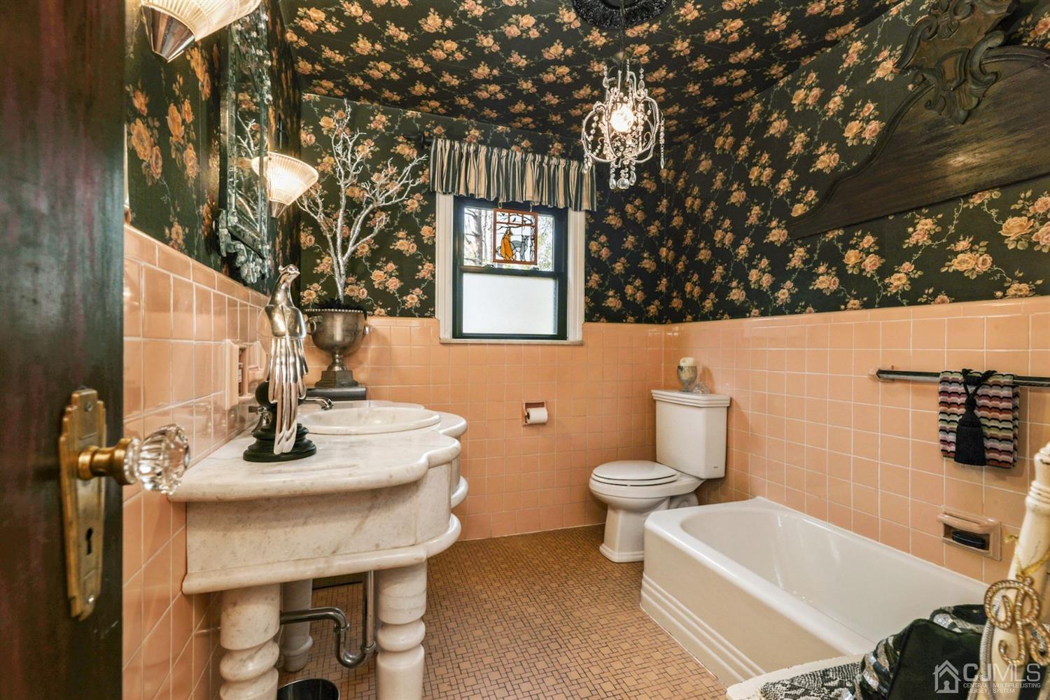 424 Chain O' Hills Road Colonia, NJ 07067 - Photo 17 of 36 a bathroom with a sink a toilet and mirror