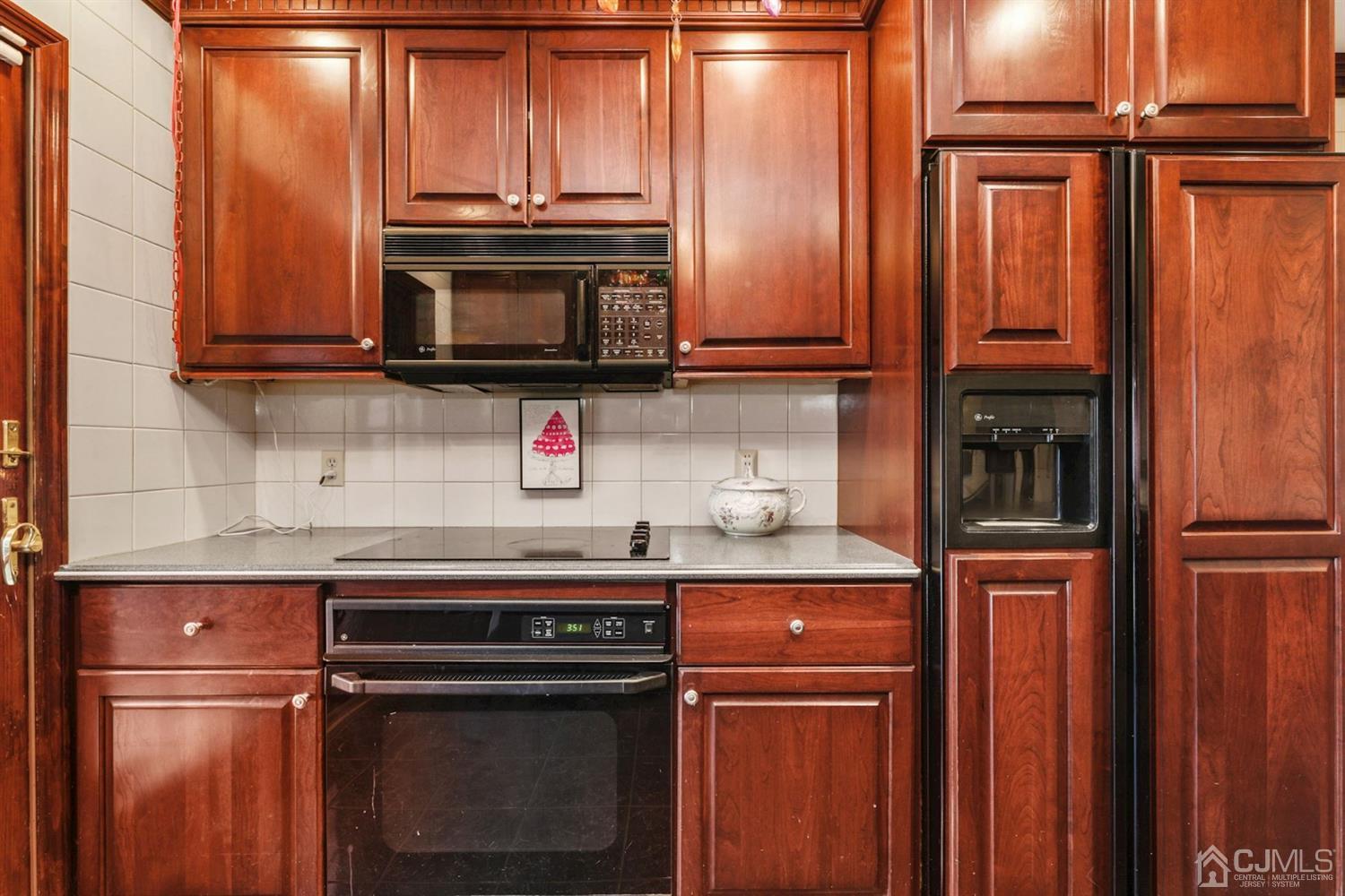 424 Chain O' Hills Road Colonia, NJ 07067 - Photo 20 of 36 a kitchen with granite countertop stainless steel appliances and cabinets