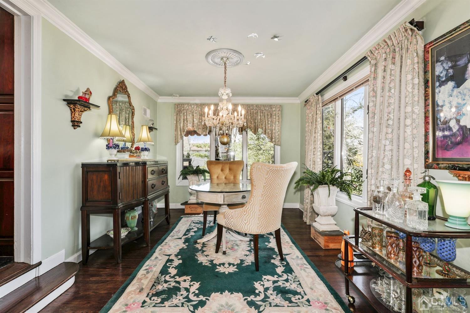 424 Chain O' Hills Road Colonia, NJ 07067 - Photo 22 of 36 a living room with furniture and a chandelier