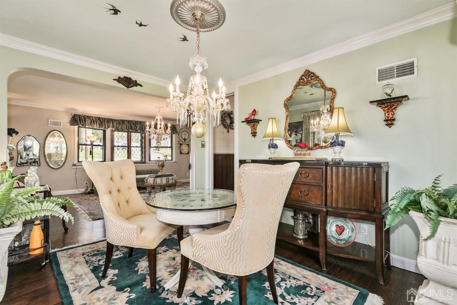 424 Chain O' Hills Road Colonia, NJ 07067 - Photo 23 of 36 a view of a dining room with furniture and chandelier