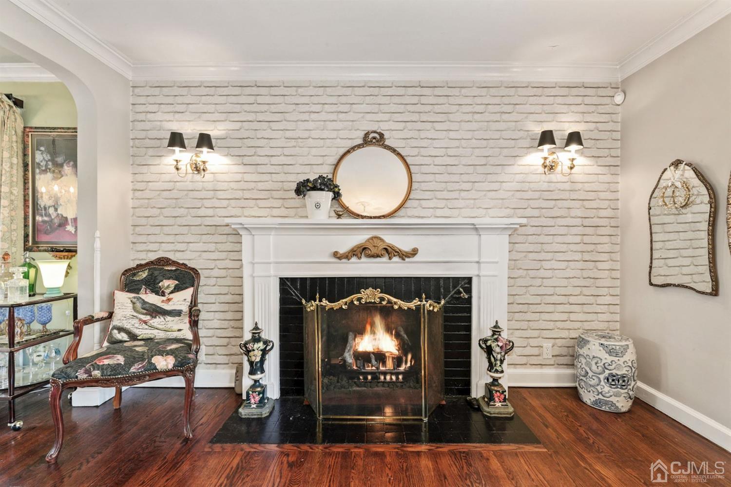 424 Chain O' Hills Road Colonia, NJ 07067 - Photo 27 of 36 a living room with furniture and a fireplace