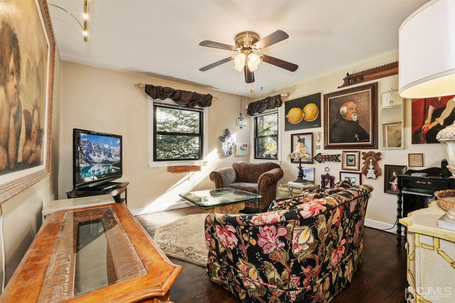 424 Chain O' Hills Road Colonia, NJ 07067 - Photo 29 of 36 a living room with furniture and a flat screen tv