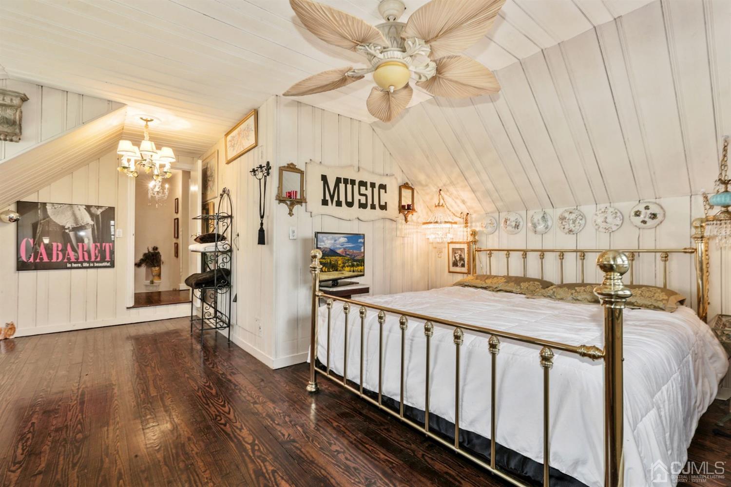 424 Chain O' Hills Road Colonia, NJ 07067 - Photo 30 of 36 a bedroom with furniture and a chandelier