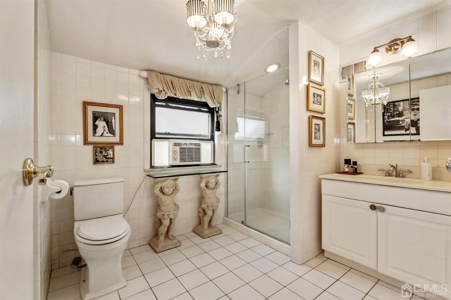 424 Chain O' Hills Road Colonia, NJ 07067 - Photo 32 of 36 a spacious bathroom with a toilet sink and shower