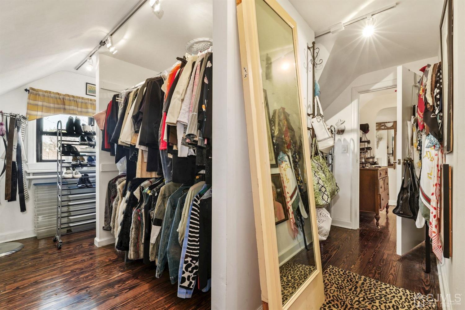 424 Chain O' Hills Road Colonia, NJ 07067 - Photo 34 of 36 a view of walk in closet with clothes and shoes