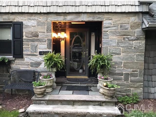 424 Chain O' Hills Road Colonia, NJ 07067 - Photo 36 of 36 a front view of a house with potted plants