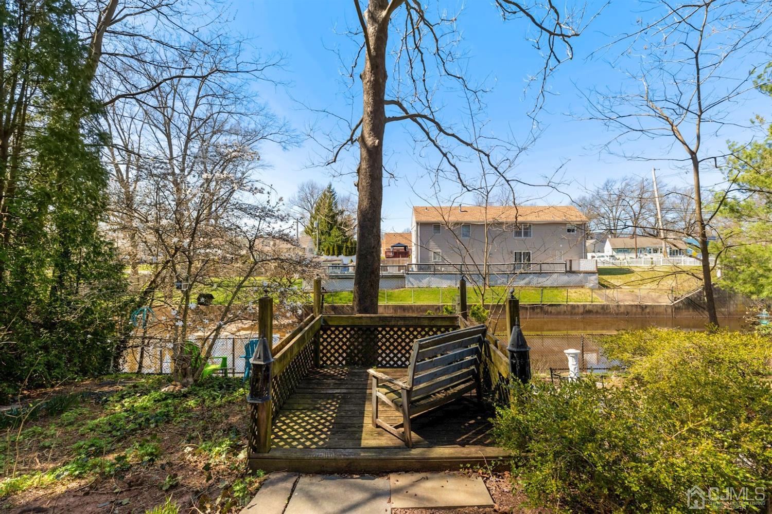 424 Chain O' Hills Road Colonia, NJ 07067 - Photo 5 of 36 a view of swimming pool with outdoor seating and a pathway