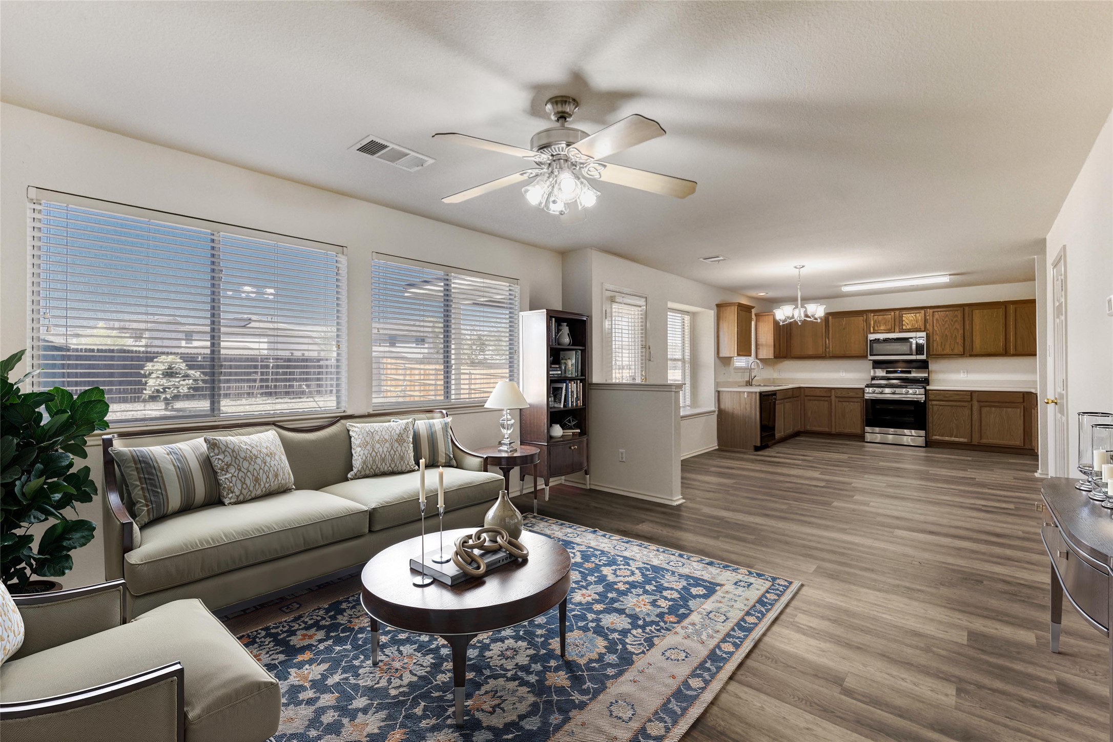 14716 Lipton Lane Pflugerville, TX 78660 - Photo 4 of 26 a living room with furniture and a wooden floor