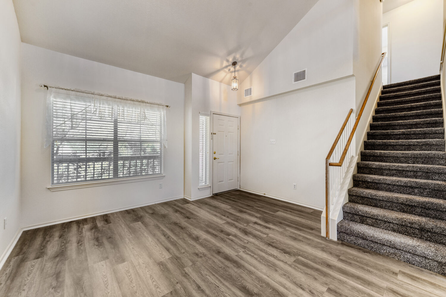 14716 Lipton Lane Pflugerville, TX 78660 - Photo 10 of 26 wooden floor in an empty room with a window