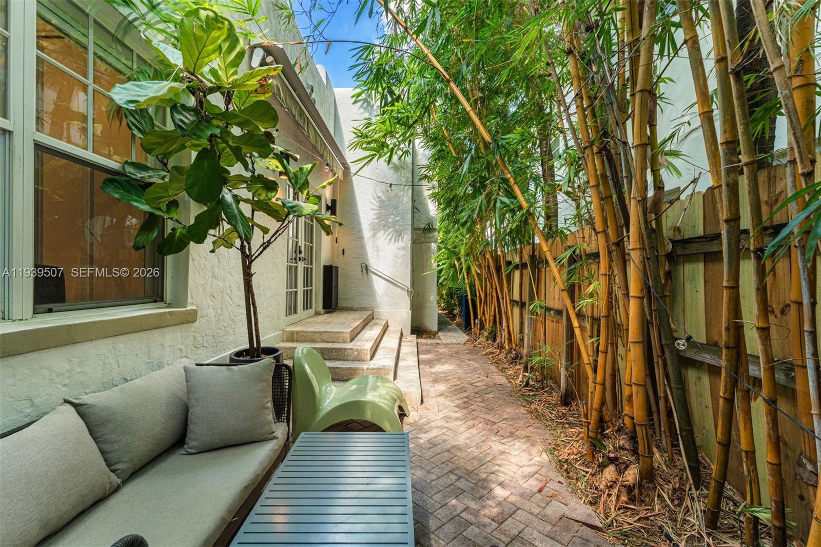 1045 Michigan Avenue, Unit B Miami Beach, FL 33139 - Photo 11 of 15 a view of a house with backyard and sitting area