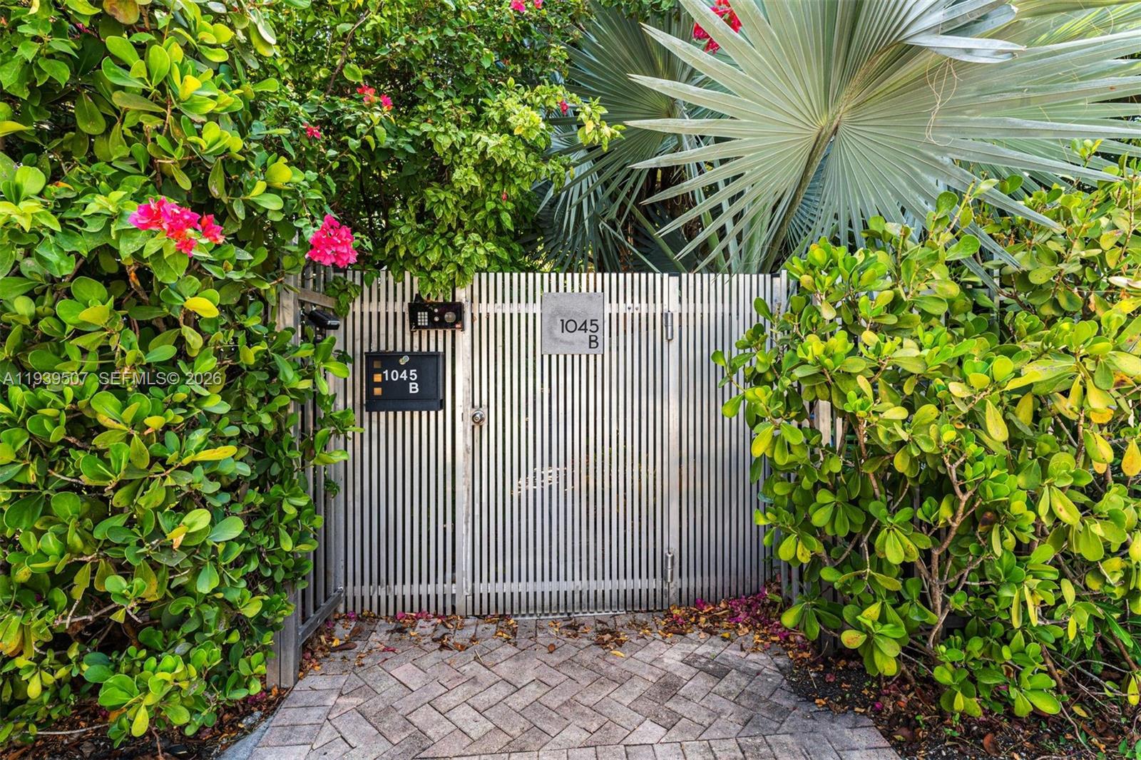 1045 Michigan Avenue, Unit B Miami Beach, FL 33139 - Photo 14 of 15 a sign that is sitting in front of a house