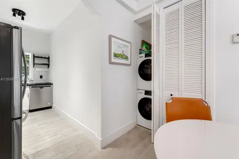 a view of a living room and bathroom with a tub