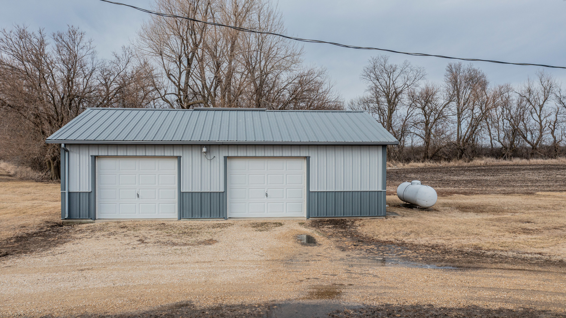 794 Carnahan Road Compton, IL 61318 - Photo 21 of 24 a view of a house with backyard and trees in the background