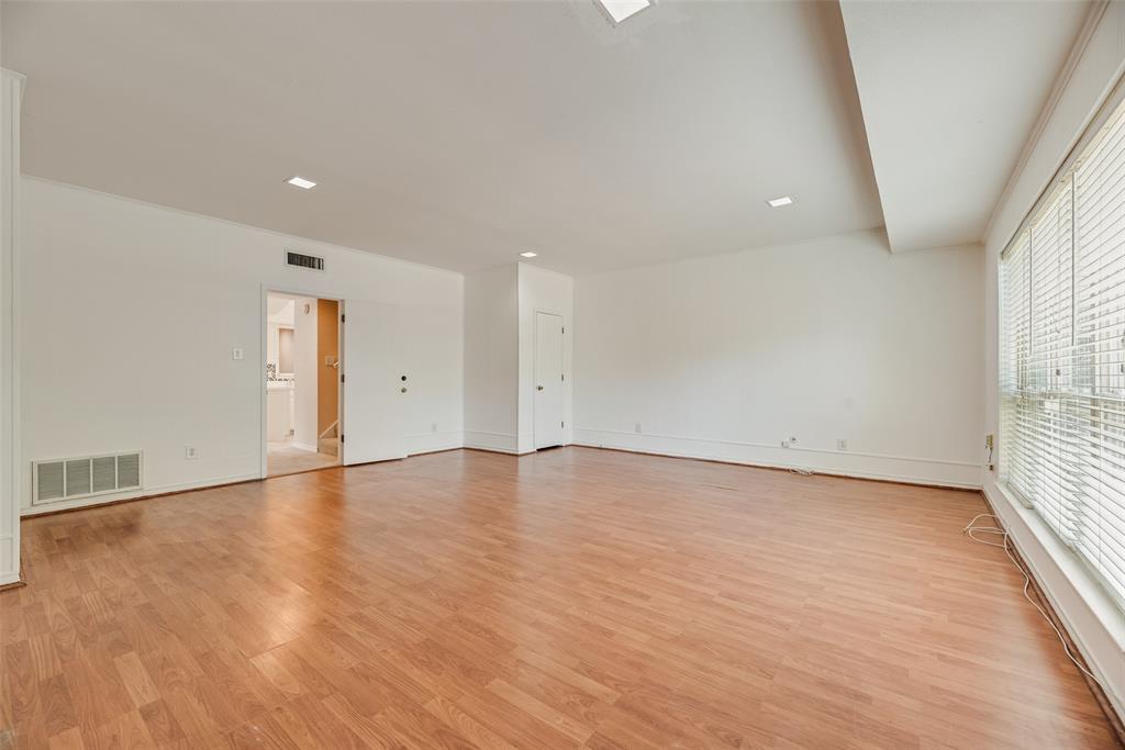 4988 Thunder Road Dallas, TX 75244 - Photo 13 of 32 Expansive living room featuring wood-finish flooring, white walls, and recessed lighting