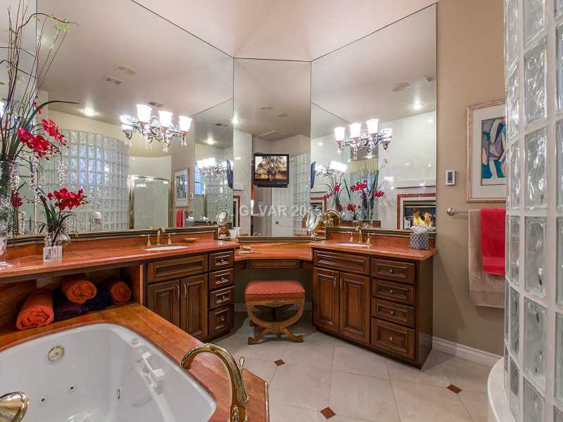 2592 Sun Reef Road Las Vegas, NV 89128 - Photo 14 of 35 Master Bath/Spa. Spa-like feel in the master bath complete with radiant floor heating and two-way fireplace next to the tub