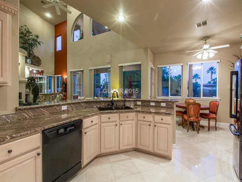2592 Sun Reef Road Las Vegas, NV 89128 - Photo 8 of 35 Kitchen. Granite counters and custom cabinetry