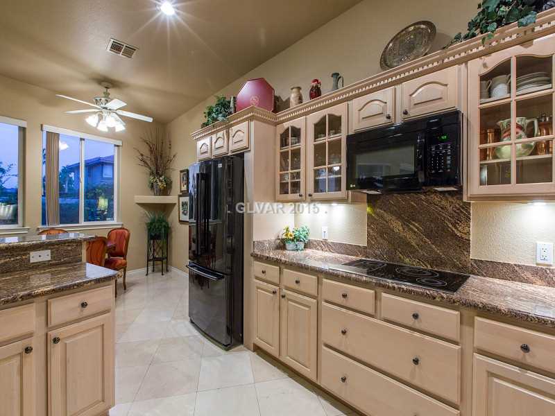 2592 Sun Reef Road Las Vegas, NV 89128 - Photo 9 of 35 Kitchen. Lots of beautiful cabinets and a walk-in pantry too