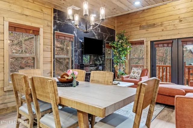 a view of a room that has a couch and a potted plant