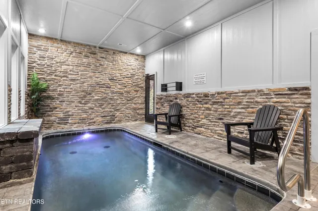 a bathroom with a sink a large mirror and bathtub