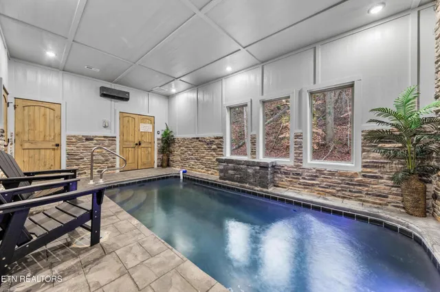 a view of a bathroom with a sink and wooden floor