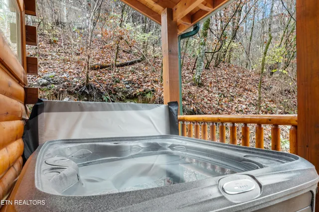 a bed room with a bed and a large window