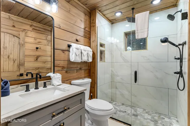 an aerial view of a house with swimming pool and sitting space